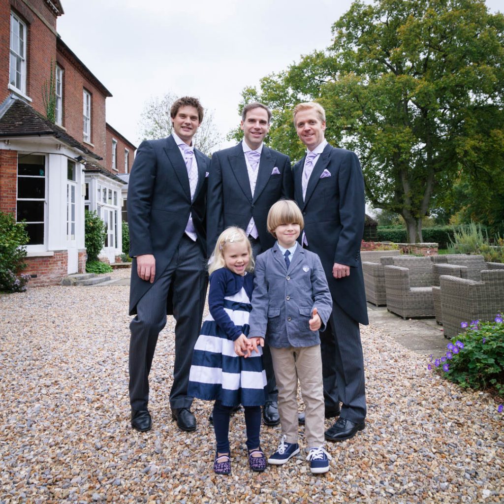 Bartley Lodge New Forest Hotel forms backdrop to photo of groomsmen and children