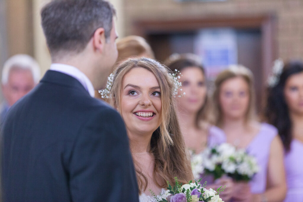 Church of the Immacualte Conception, Portswood, Southampton – bride looks adoringly at groom