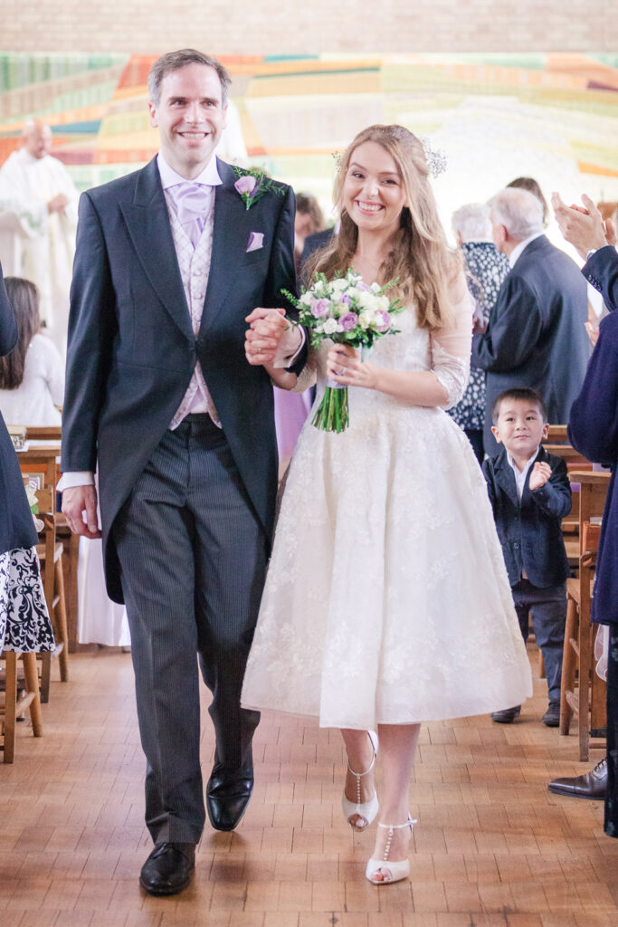 Church of the Immacualte Conception, Portswood, Southampton – bride and groom walking down the aisle