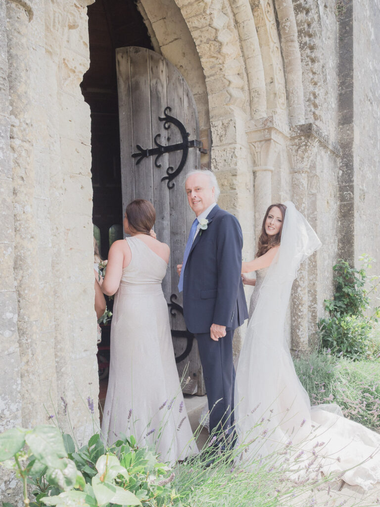 Bride and her fathrer outside church just before her wedding
