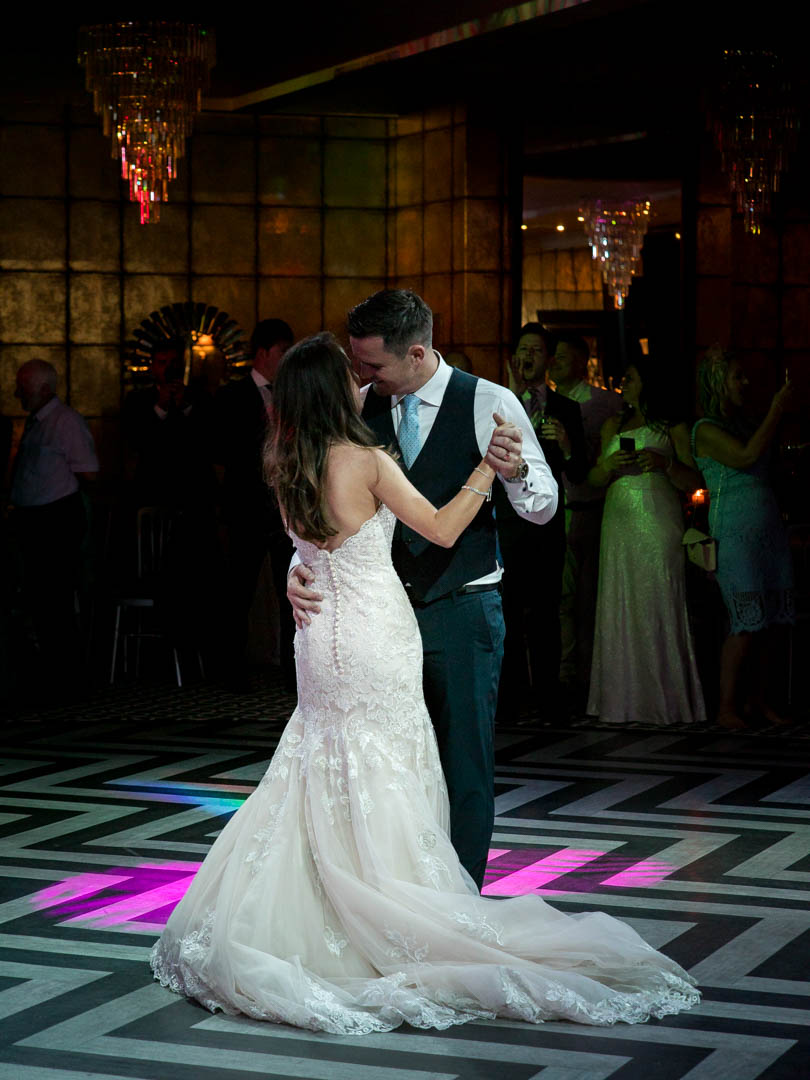 Bride and groom enjoy their first dance together at the Old Thorns Hotel, Liphook