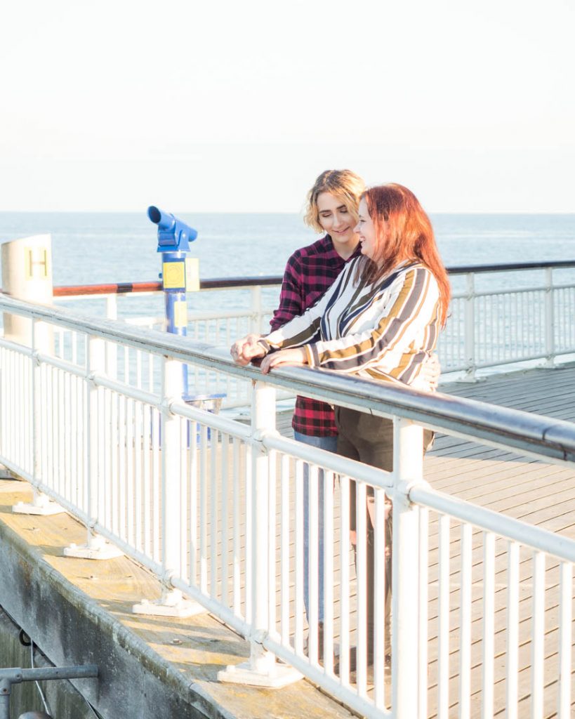 Lesbian couple talking on Bournemouth Pier