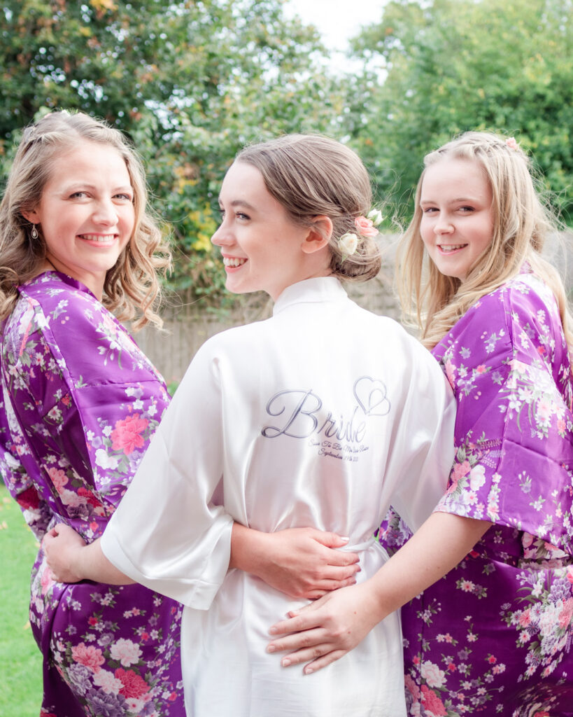 Michaela and her bridesmaids in their commemorative wedding dressing robes