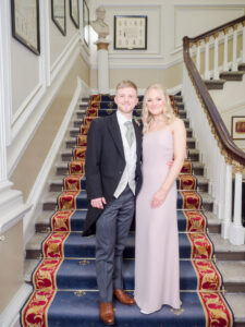 Bridegroom and his sister on the stairs at the Naval and Military Club