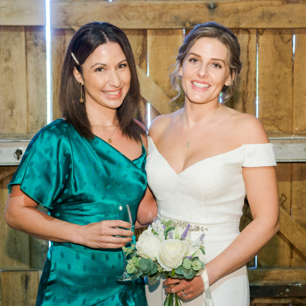 Bride and sister in Titchfield Great Barn