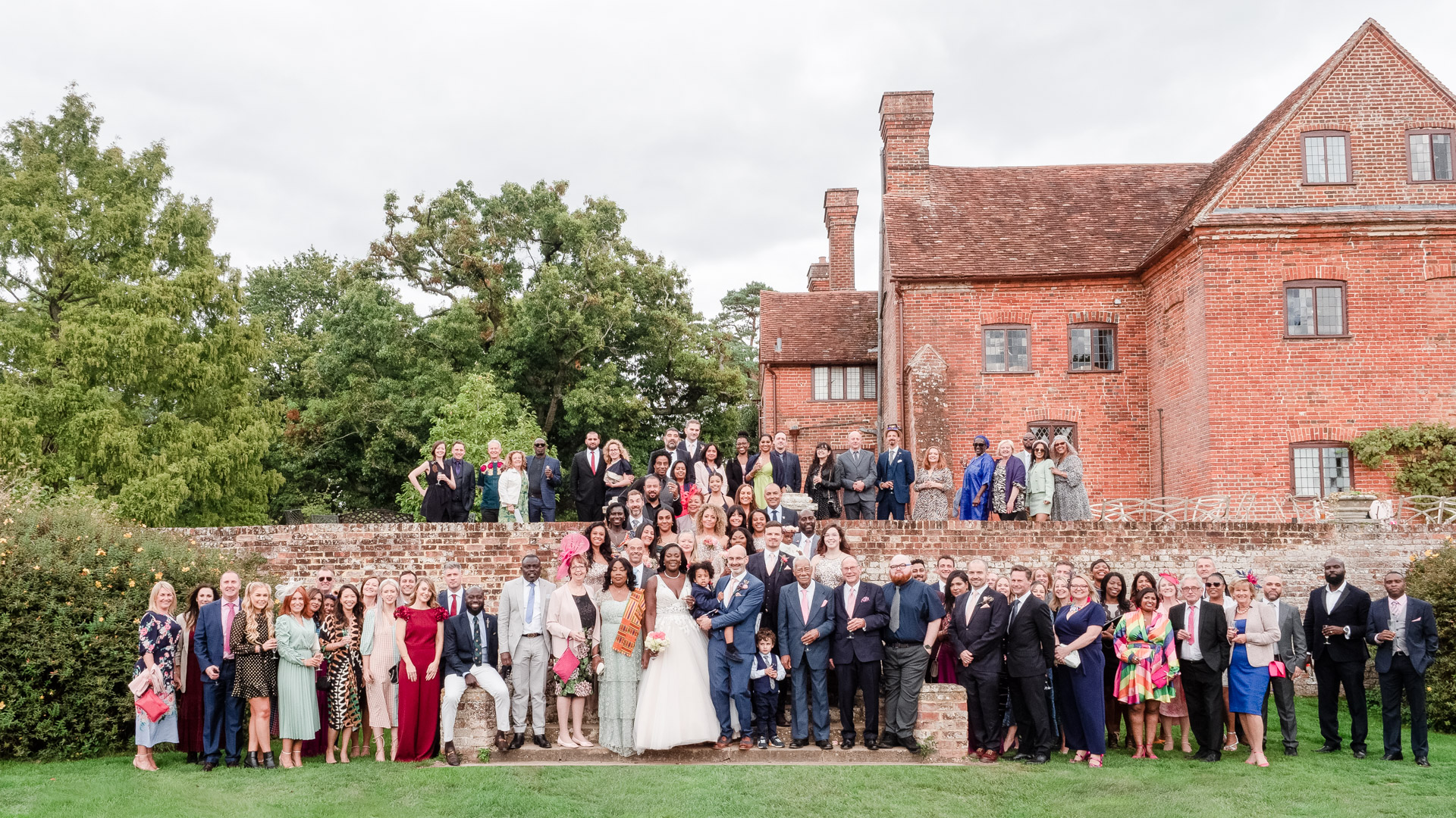 Wedding group photo in the garden at Ufton Court