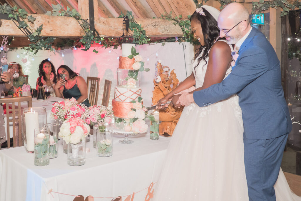 Bride and groom cut cake