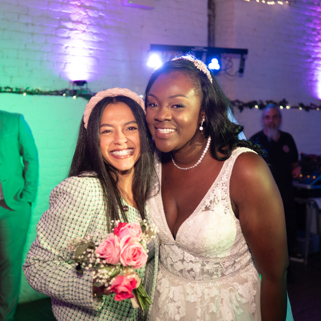 Bride with friend who caught bouquet
