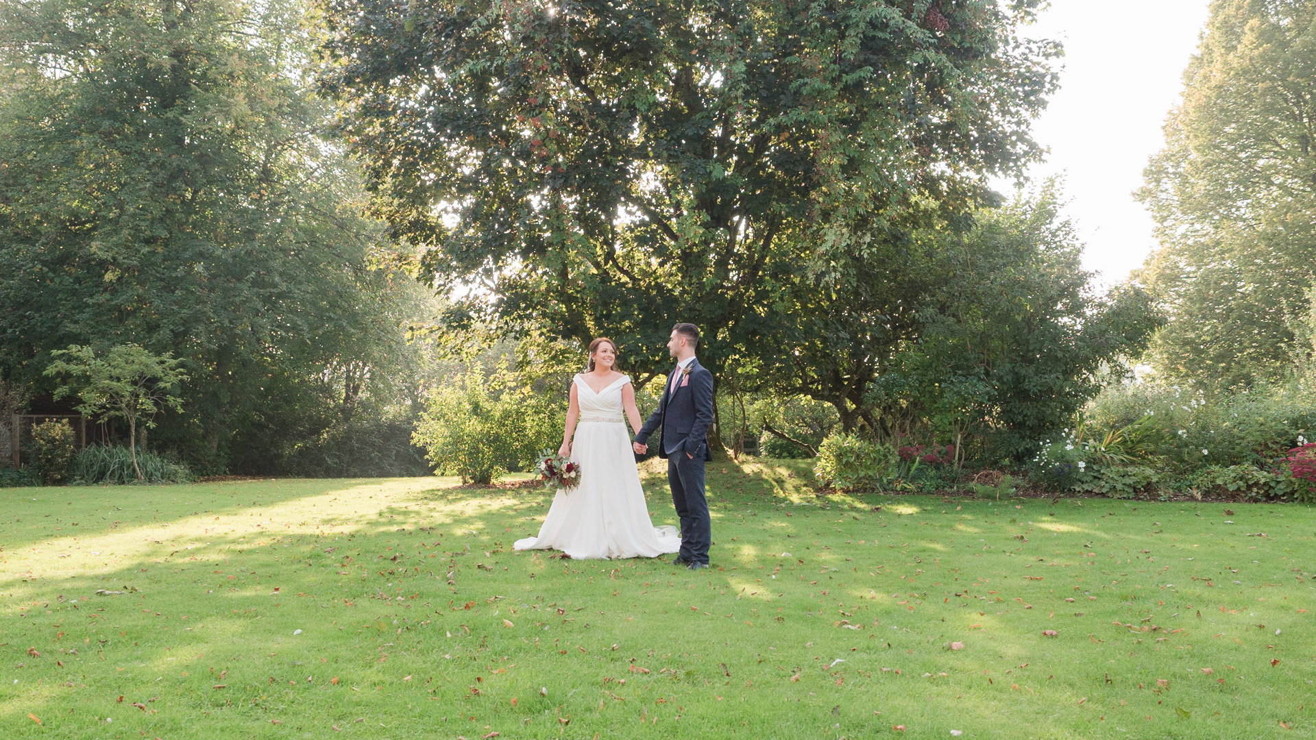 Bride and groom in the garden at Clock Barn