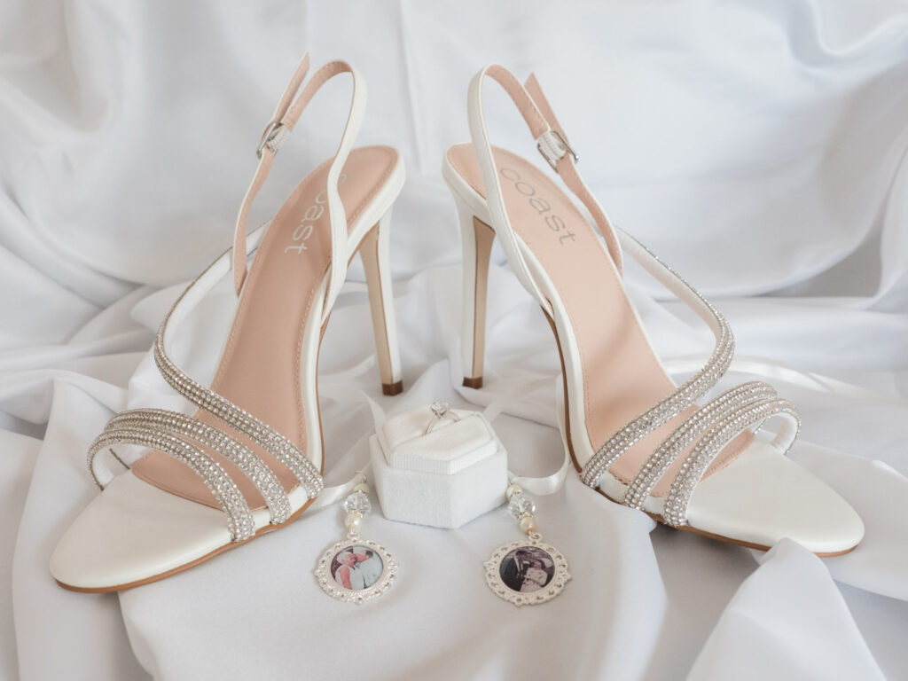 Bride's shoes, engagement ring and charms