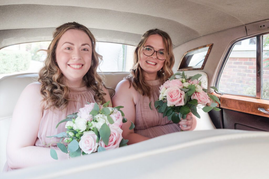 Bridesmaids in their wedding car