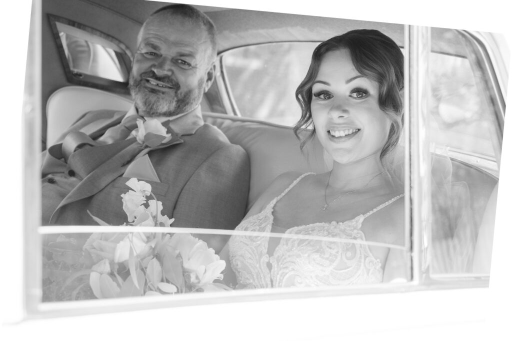 Bride and her father in their wedding car