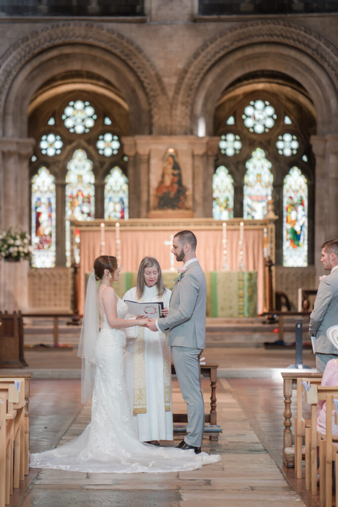 Bride and groom make their vows in Romsey Abbey