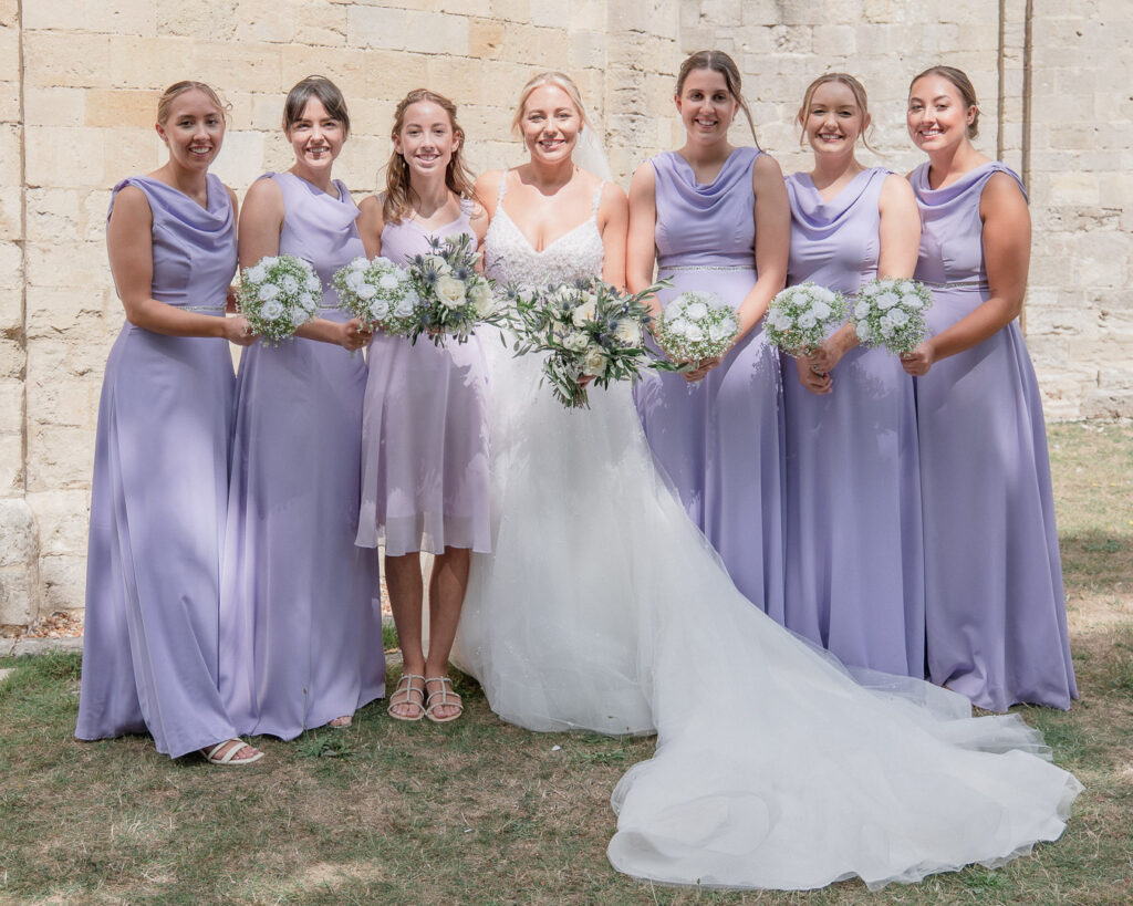 Bridesmaids outside Romsey Abbey