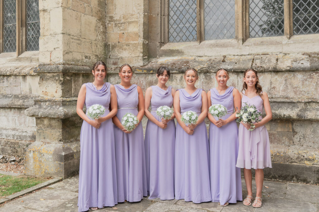 Bridesmaids outside Romsey Abbey