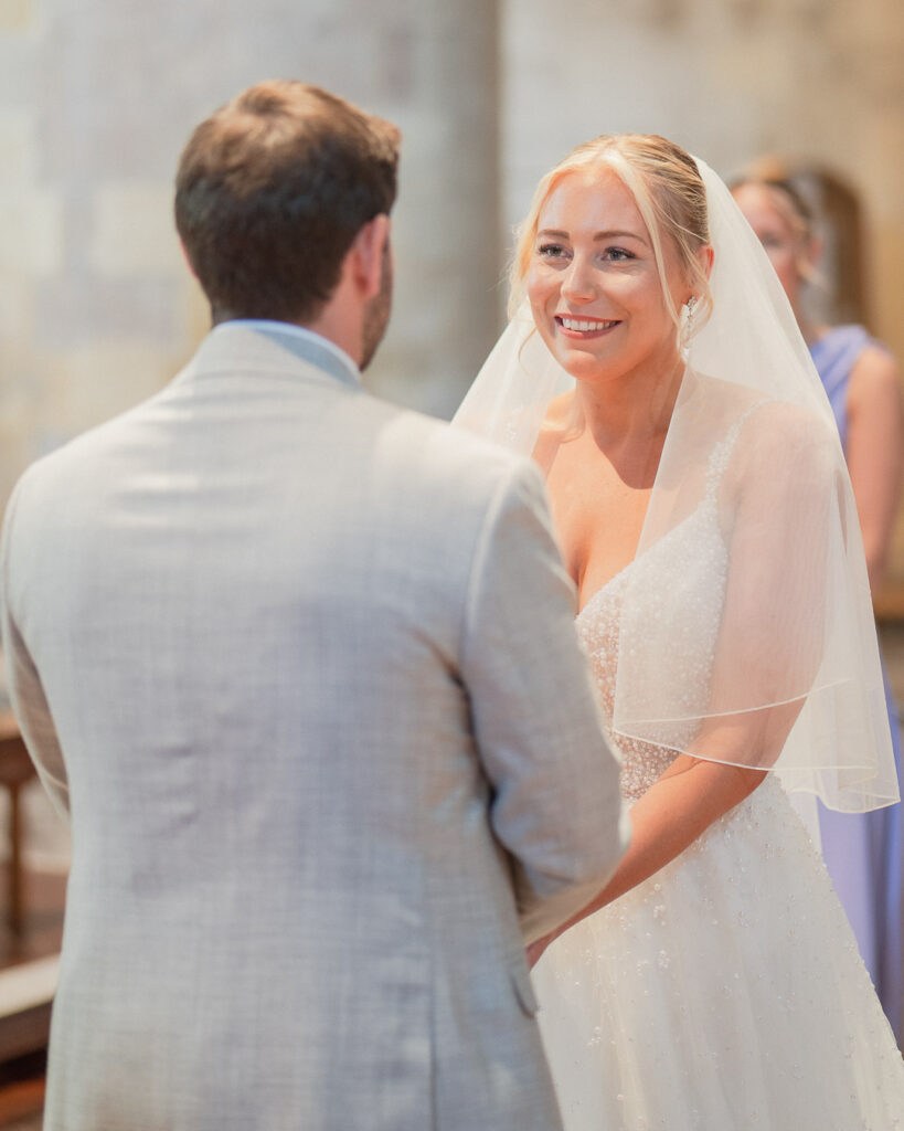 Bride and groom exchange their vows in Romsey Abbey